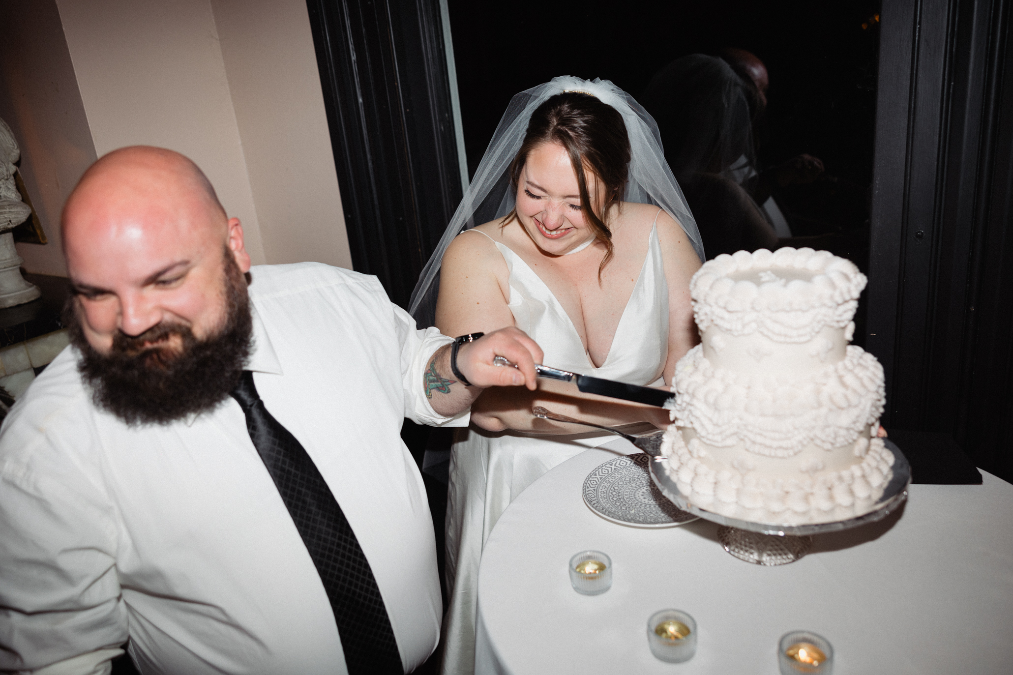 couple cutting wedding cake