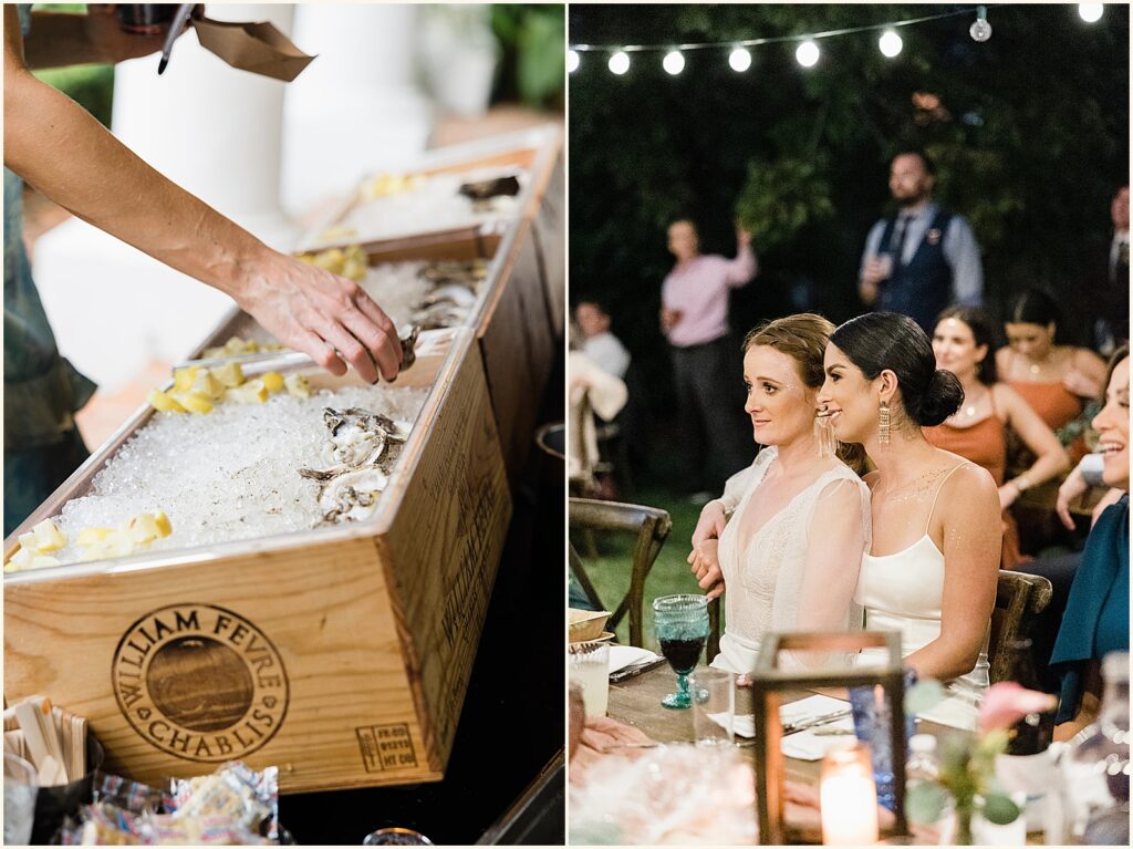 Wedding guests pick up oysters at a buffet.