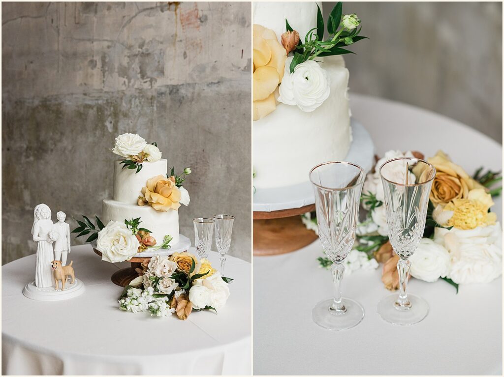 Two champagne flutes sit beside a wedding cake.