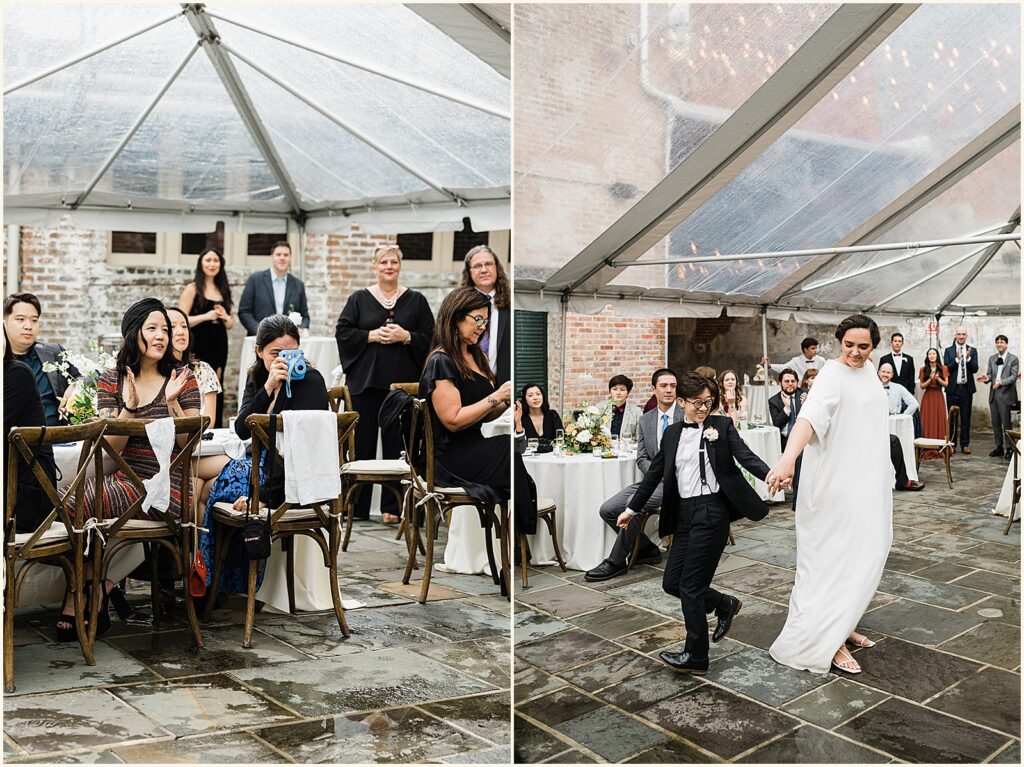 Two marriers share their first dance as guests watch.