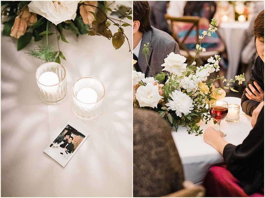 An Instax photo sits on a wedding reception table beside two candles.