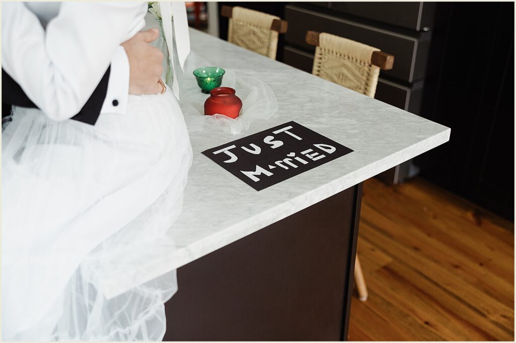 A "just married" sign sits on a kitchen counter.