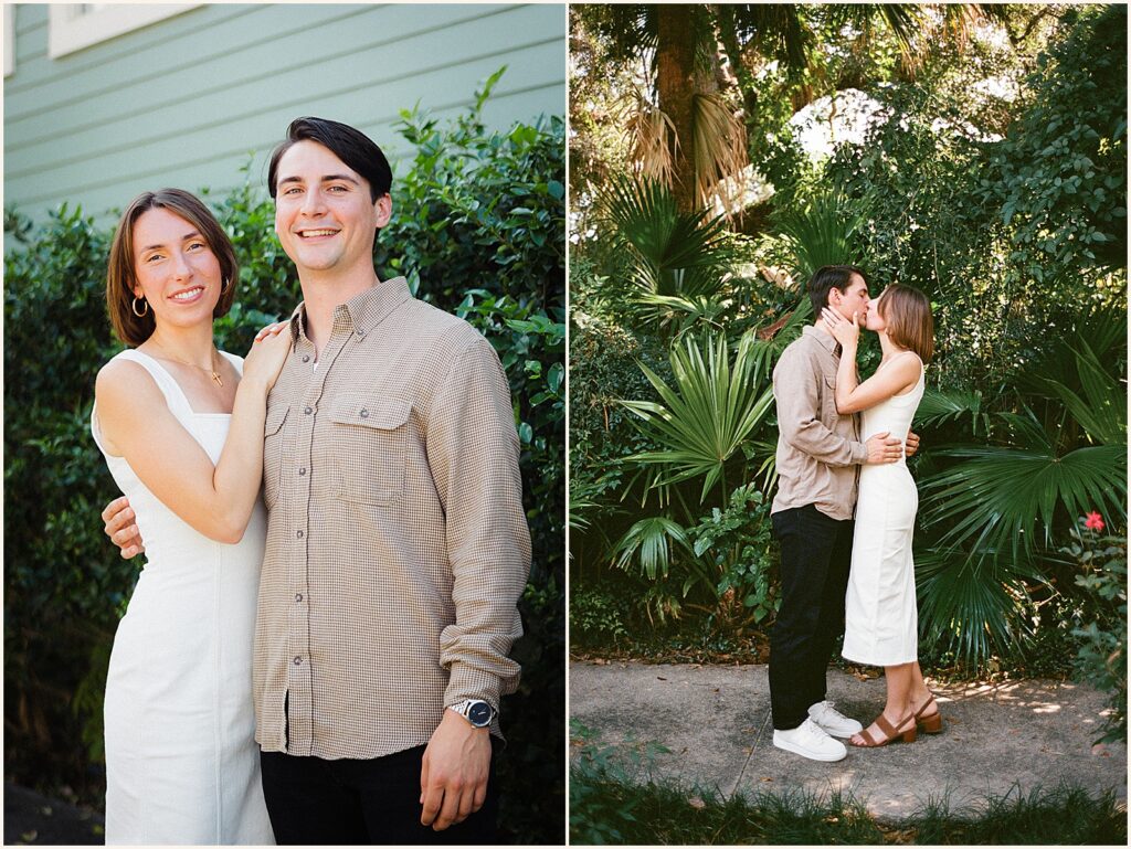 A woman leans on her fiancee's shoulder in front of a colorful Garden District home.