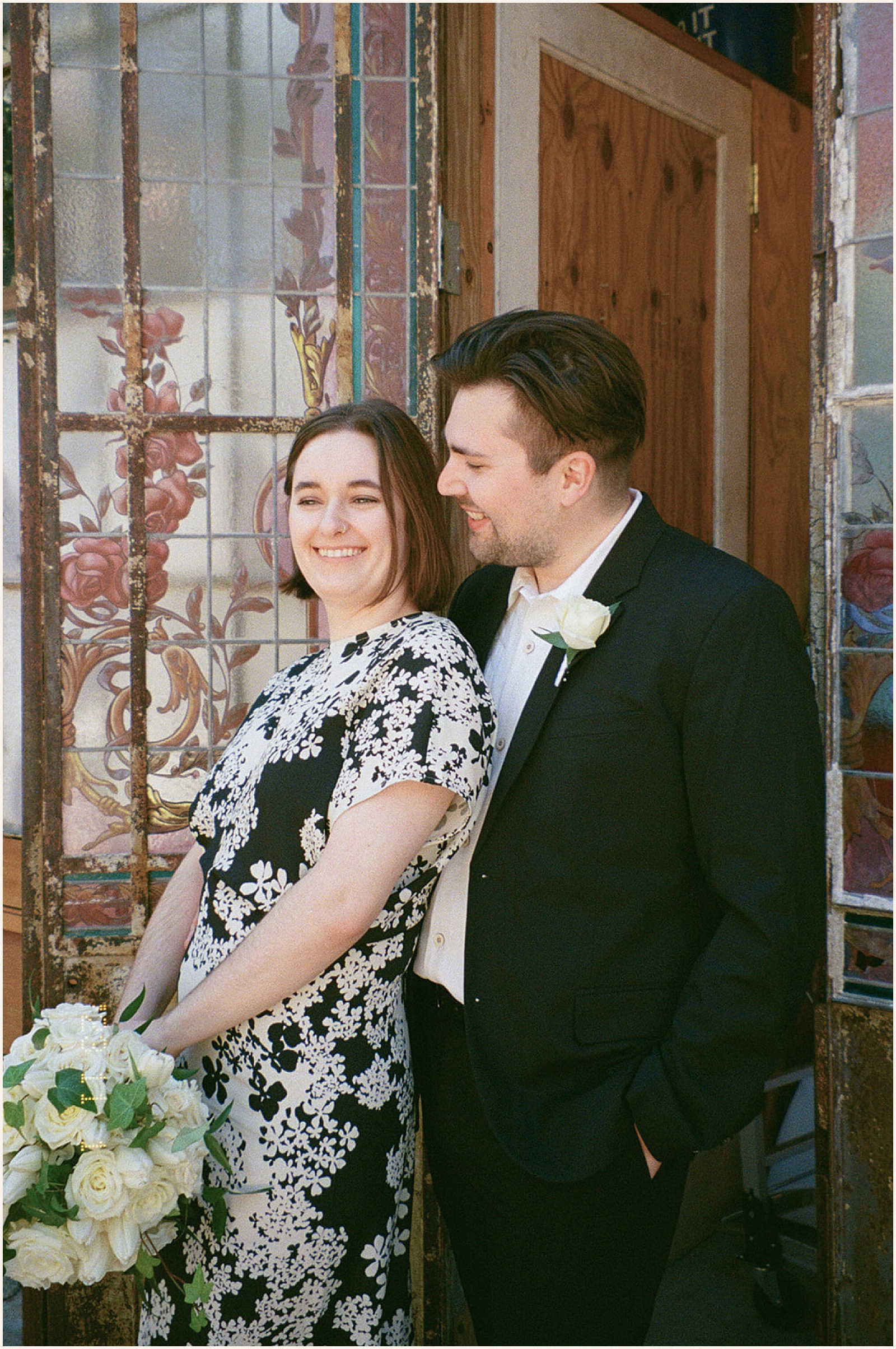 A bride leans against a groom before a New Orleans elopement at Race and Religious.