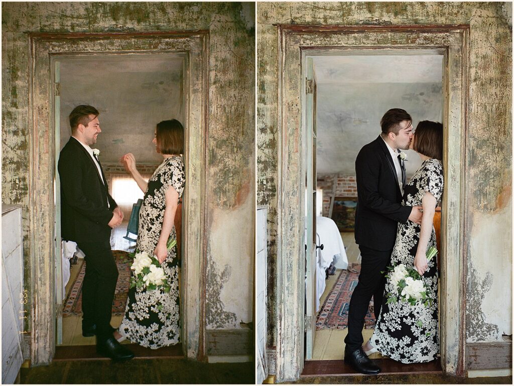 A bride and groom kiss in a doorway at a New Orleans elopement.
