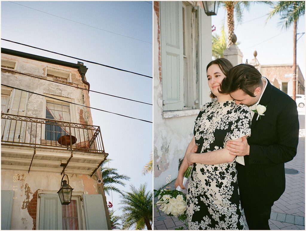 A groom kisses a bride's shoulder in a New Orleans wedding venue courtyard.