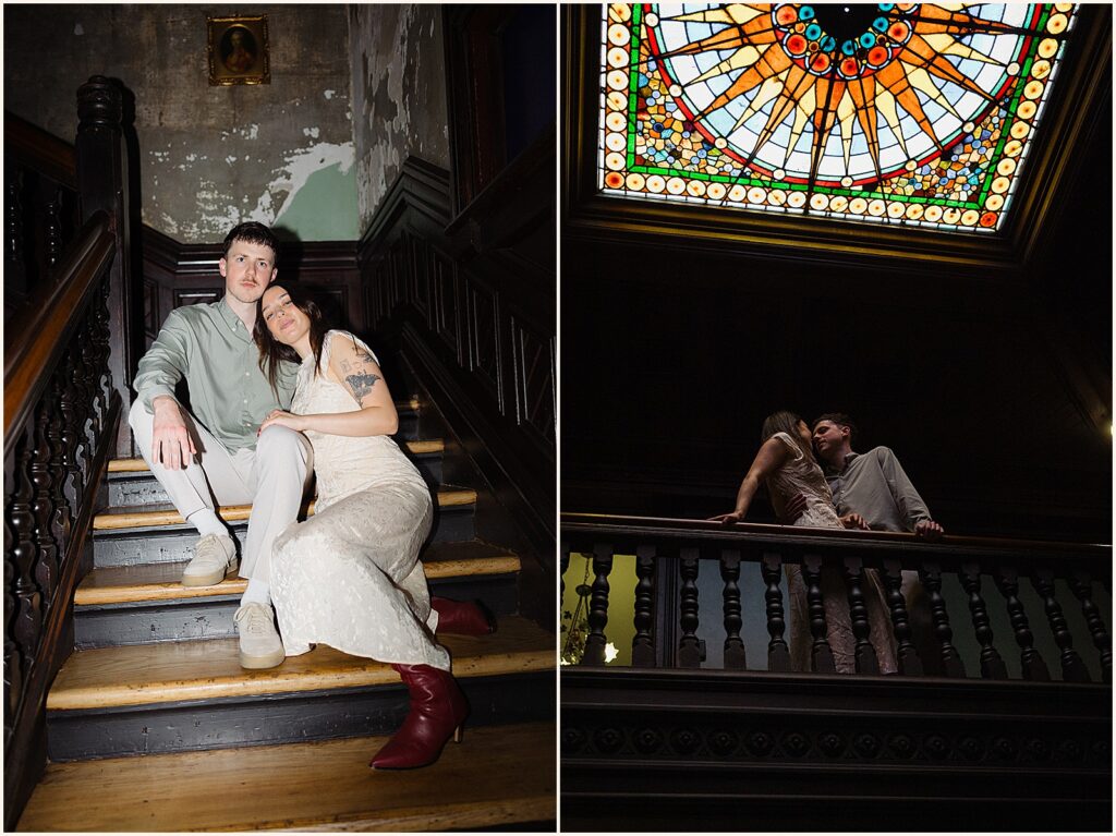 A man and woman sit on the stairs of the Column Hotel for New Orleans engagement photos.
